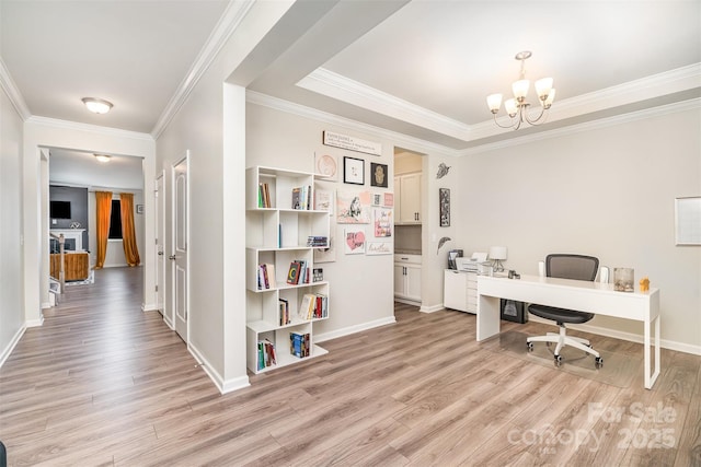 office area featuring baseboards, light wood-style floors, a chandelier, and ornamental molding