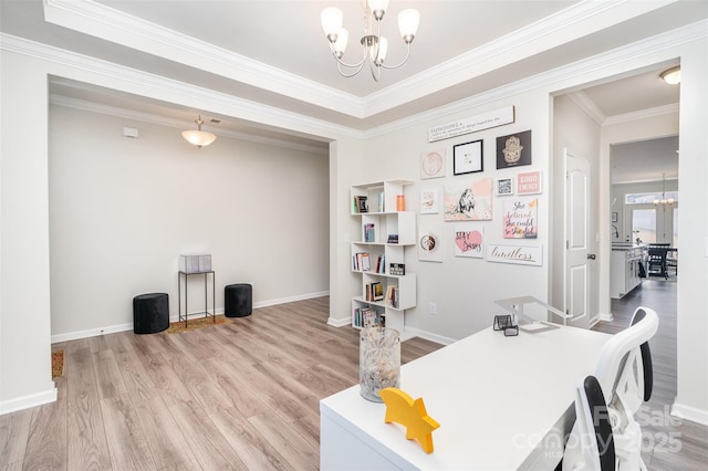 office area with baseboards, a notable chandelier, wood finished floors, and ornamental molding