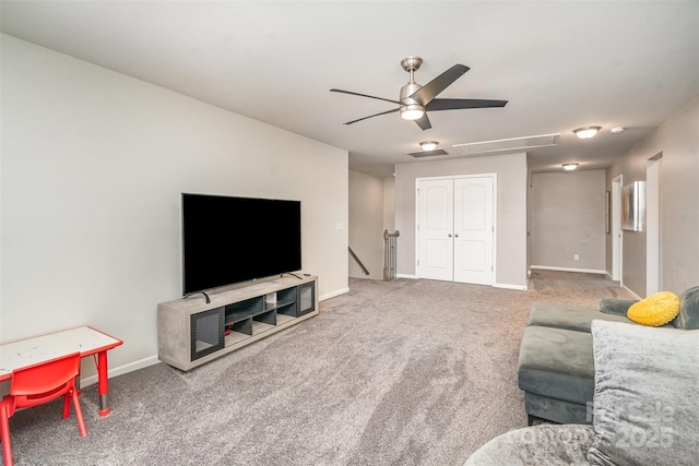 carpeted living area with attic access, baseboards, and visible vents