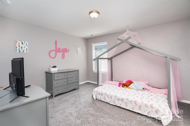 bedroom with baseboards and carpet flooring