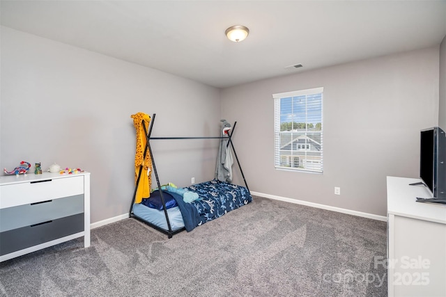 carpeted bedroom with visible vents and baseboards