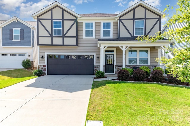 19113 Hawk Haven Ln, Charlotte, NC 28278 - tudor house with concrete driveway, a front lawn, an attached garage, and stone siding