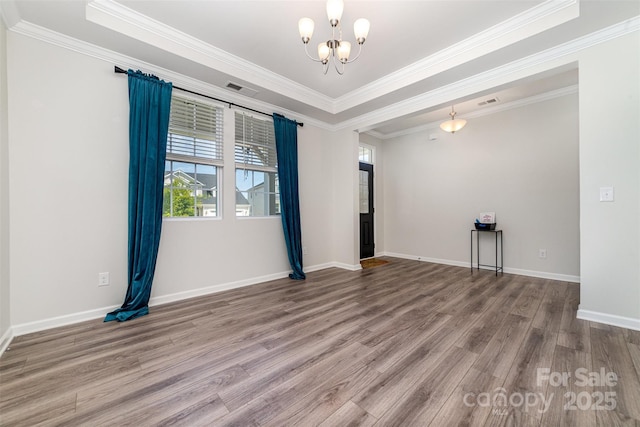 19113 Hawk Haven Ln, Charlotte, NC 28278 - unfurnished room with a chandelier, wood finished floors, and crown molding