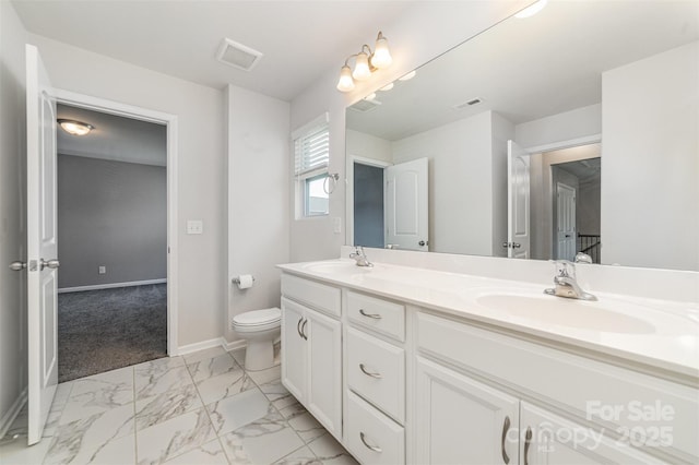 19113 Hawk Haven Ln, Charlotte, NC 28278 - bathroom with double vanity and marble finish floors