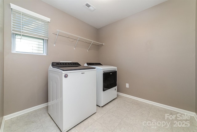 19113 Hawk Haven Ln, Charlotte, NC 28278 - laundry area featuring washing machine and clothes dryer and baseboards