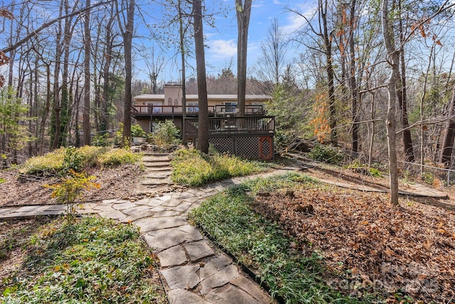 view of yard with a wooden deck