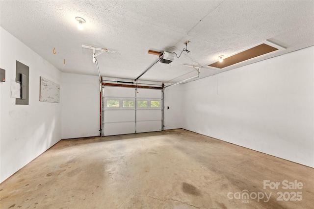 garage with electric panel and a garage door opener