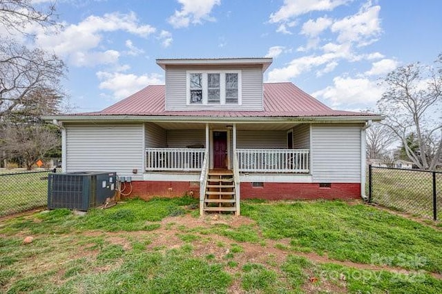 bungalow-style home with a front lawn, a porch, fence, crawl space, and central AC unit