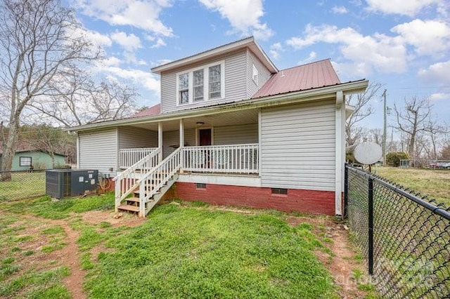 view of front of property with crawl space, central AC unit, covered porch, and fence