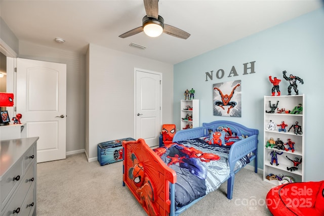 bedroom featuring a ceiling fan, light colored carpet, visible vents, and baseboards