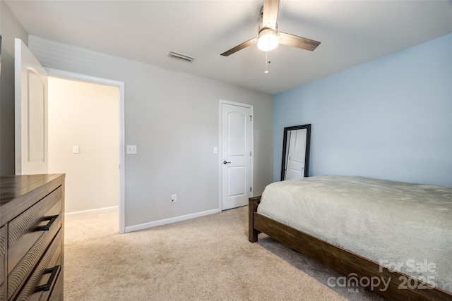 bedroom with carpet, visible vents, ceiling fan, and baseboards