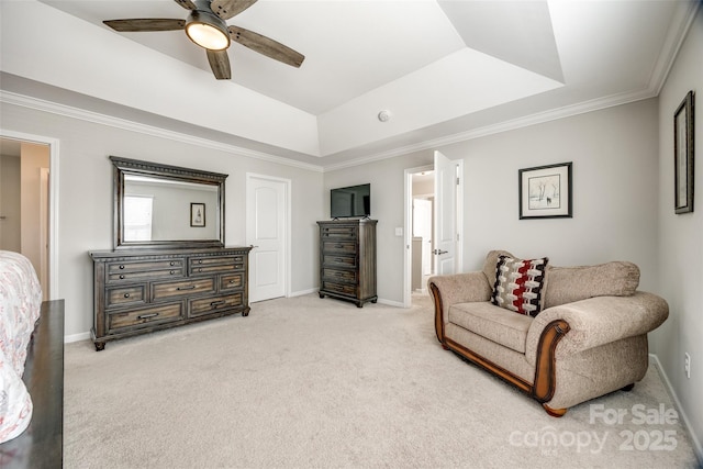 sitting room featuring ceiling fan, light carpet, baseboards, ornamental molding, and a tray ceiling