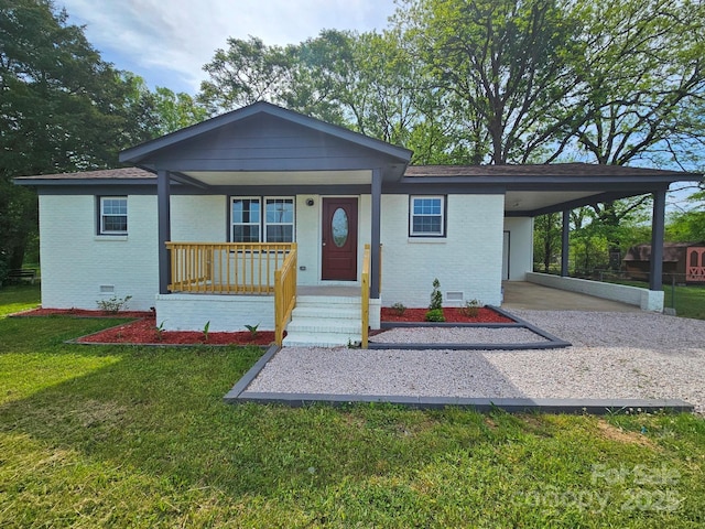 view of front of property with crawl space, a porch, a carport, and brick siding