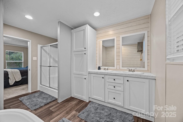 11 Pyrite Way, Asheville, NC 28806 - bathroom with a stall shower, wood finished floors, double vanity, ensuite bath, and recessed lighting
