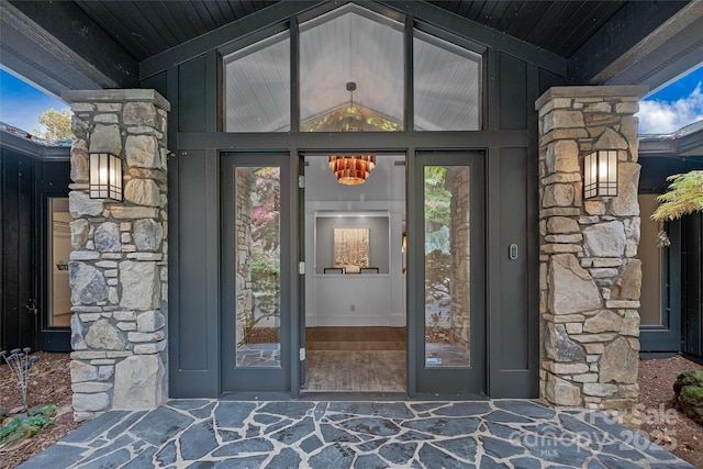 entrance to property with stone siding