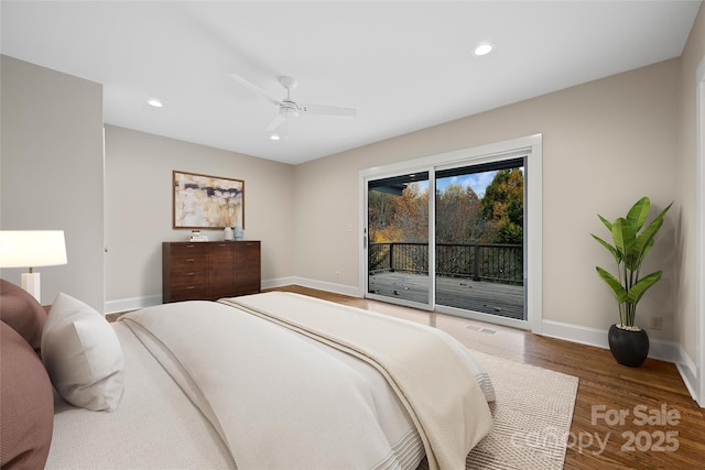 bedroom featuring recessed lighting, wood finished floors, visible vents, baseboards, and access to exterior