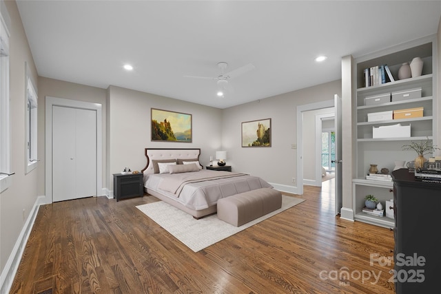 bedroom with dark wood-style flooring, recessed lighting, visible vents, and baseboards