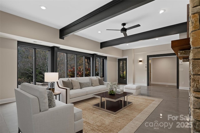 living area with baseboards, beamed ceiling, and recessed lighting