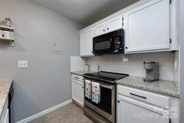 kitchen featuring black microwave, tasteful backsplash, stainless steel range with electric cooktop, white cabinetry, and light tile patterned flooring