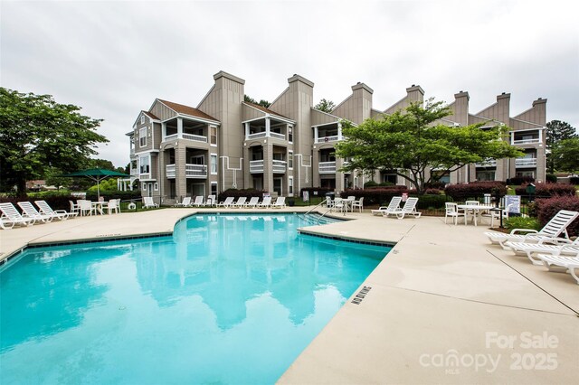 pool with a patio