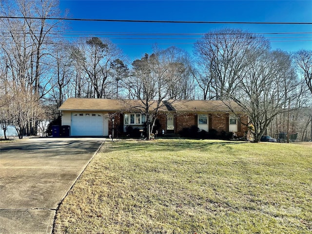 ranch-style house with driveway, brick siding, a garage, and a front yard