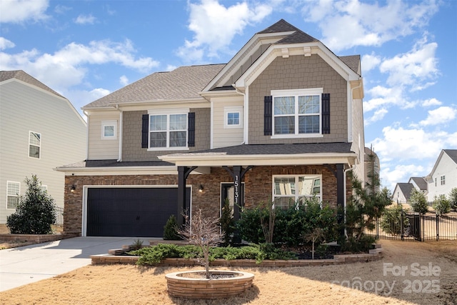 craftsman-style home with driveway, a garage, a shingled roof, fence, and brick siding