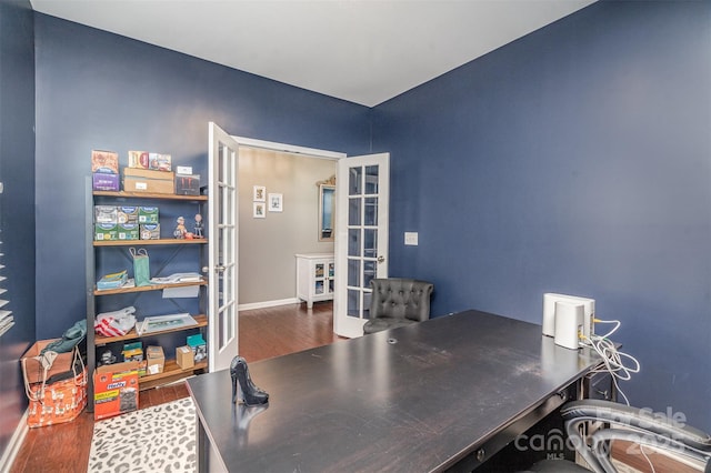 office space with french doors, baseboards, and wood finished floors