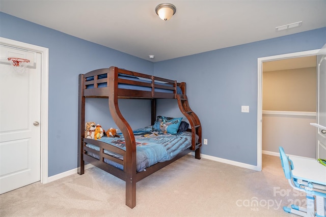 bedroom with light colored carpet, visible vents, and baseboards