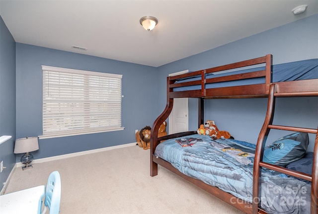 carpeted bedroom with baseboards and visible vents