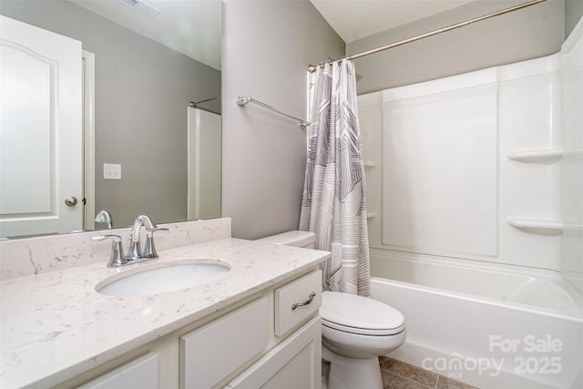 bathroom featuring visible vents, shower / tub combo with curtain, vanity, and toilet