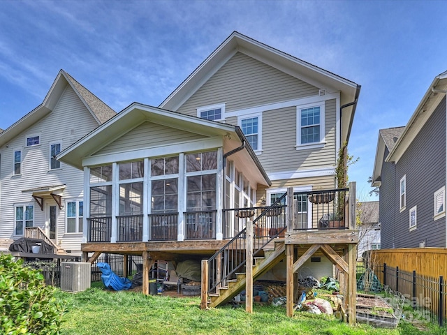 1905 Summey Ave, Charlotte, NC 28205 - back of property featuring a sunroom, stairs, central AC, and a wooden deck