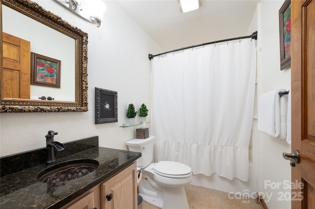 full bath with vanity, shower / tub combo, and toilet