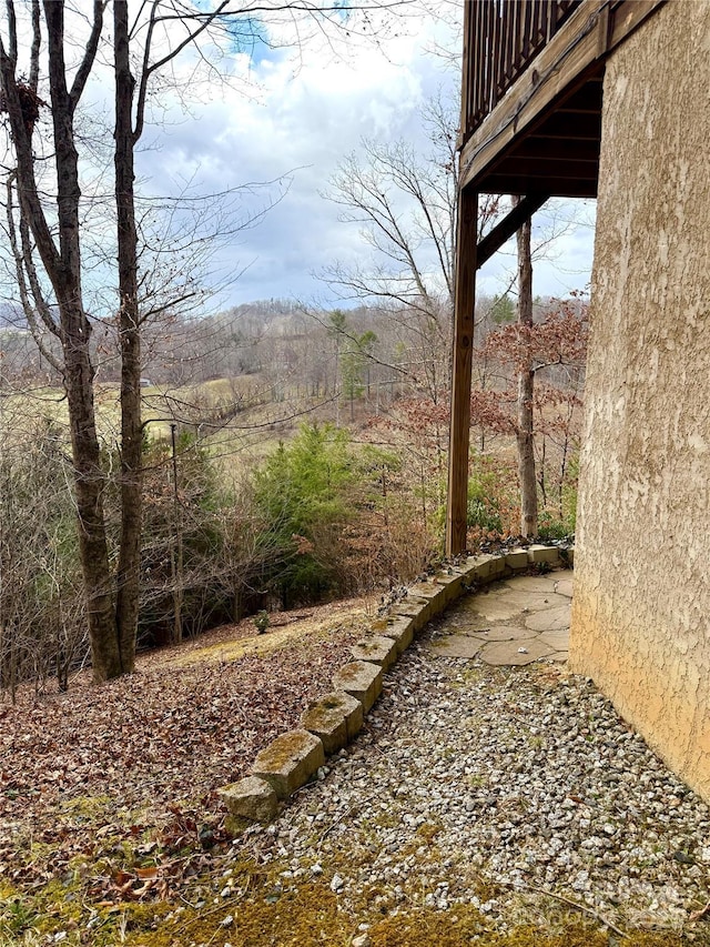 view of yard featuring a view of trees