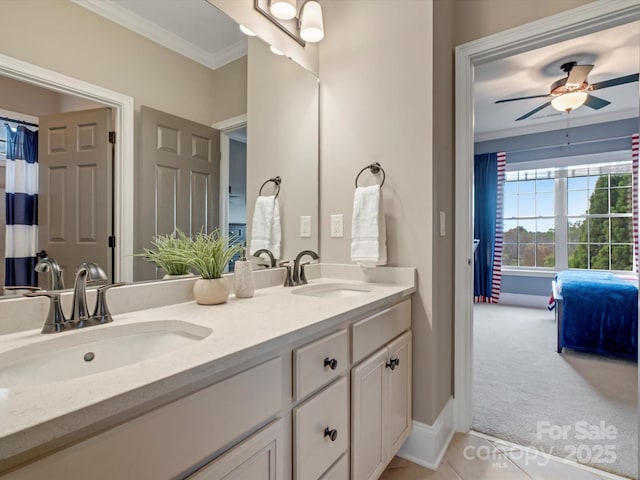 full bath featuring double vanity, a sink, ornamental molding, and ceiling fan