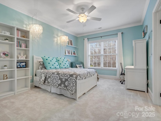 carpeted bedroom with visible vents, baseboards, crown molding, and ceiling fan with notable chandelier
