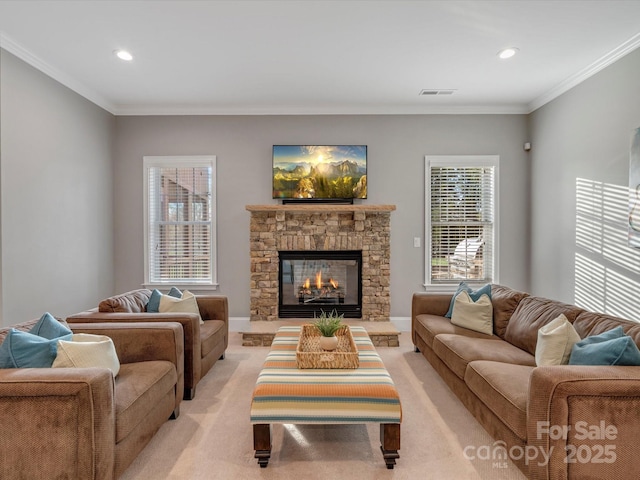 living area with recessed lighting, a fireplace, visible vents, and ornamental molding