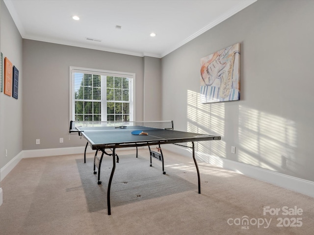 recreation room with baseboards, recessed lighting, crown molding, visible vents, and light colored carpet