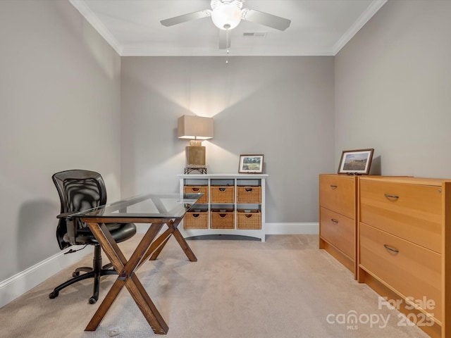 office area featuring light carpet, visible vents, ornamental molding, and a ceiling fan