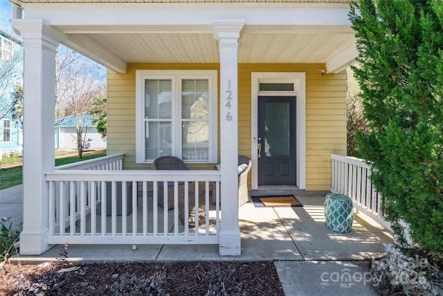 doorway to property with a porch