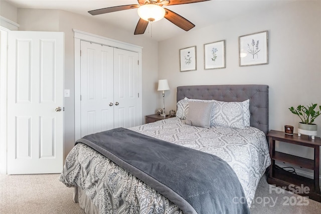 bedroom with carpet, a closet, and ceiling fan