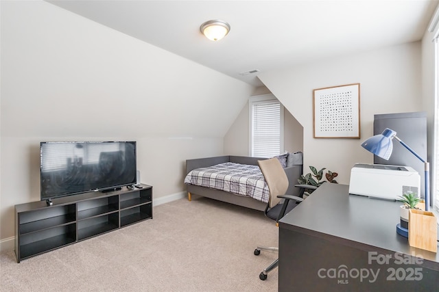 bedroom featuring vaulted ceiling, carpet floors, visible vents, and baseboards