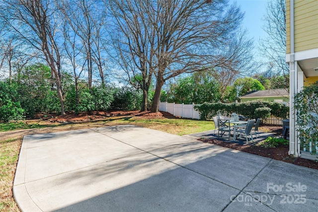 view of patio / terrace featuring fence