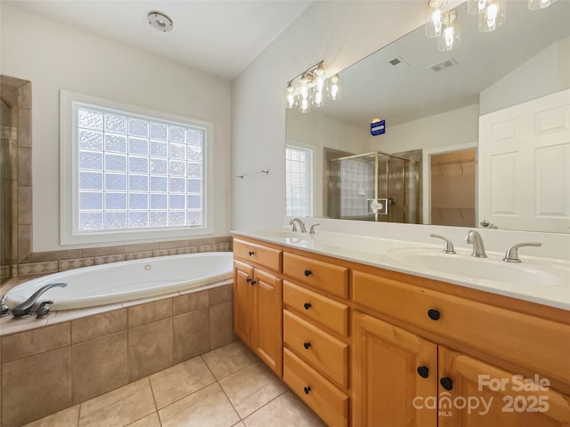 full bath featuring a stall shower, a sink, and visible vents