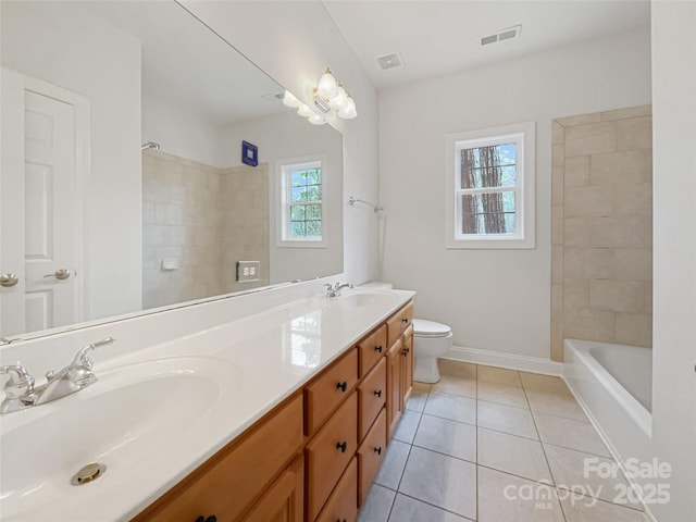 bathroom with toilet, a sink, visible vents, and tile patterned floors