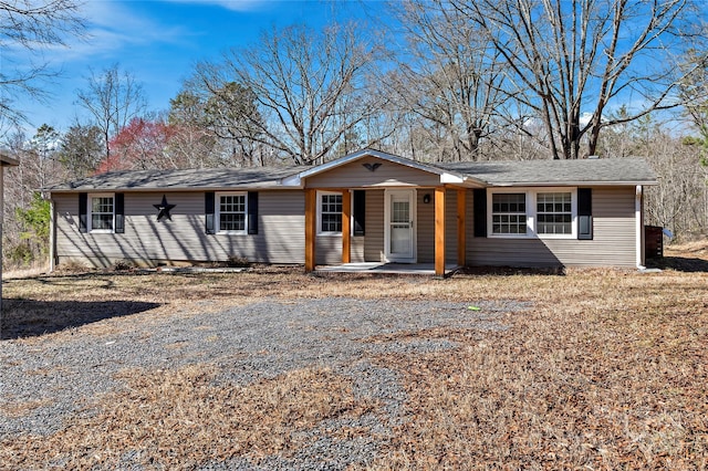 single story home with a porch