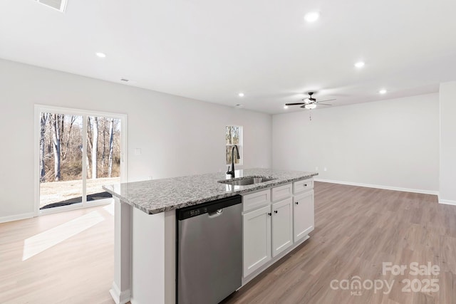 kitchen with recessed lighting, a sink, light wood-style floors, dishwasher, and a center island with sink