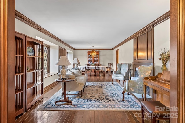 living room featuring hardwood / wood-style flooring and ornamental molding