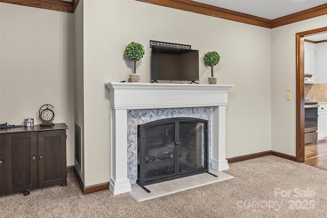 living area with baseboards, crown molding, a fireplace with flush hearth, and light colored carpet