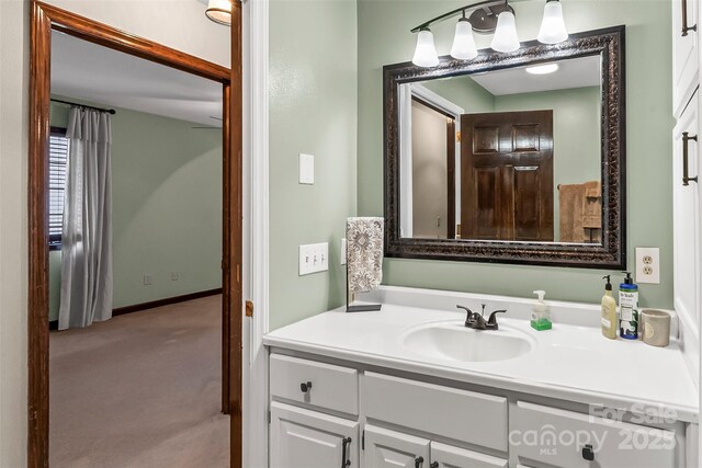 bathroom featuring vanity and baseboards