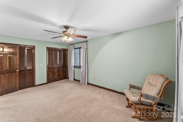 unfurnished room with light carpet, ceiling fan, and baseboards